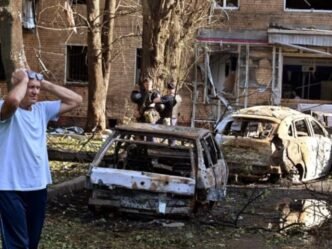 a man reacts while standing next to burnt out remains of cars in the courtyard of a multi storey residential building which according to local authorities was hit by debris from a destroyed ukrainian missile in the course of russia ukraine conflict in kursk russia photo reuters