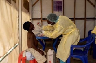 a laboratory nurse takes a sample from a child declared a suspected case mpox at a treatment centre in munigi north kivu province democratic republic of the congo on july 19 2024 photo reuters