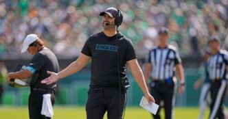 Eagles coach apologizes for yelling and gesturing angrily at fans in the stands