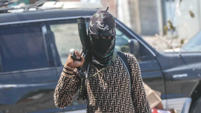 Haitian gang slaughters at least 70 people as thousands flee