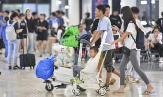 Travelers arrive at Haikou Meilan International Airport in South China