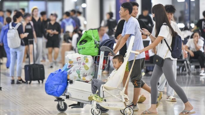 Travelers arrive at Haikou Meilan International Airport in South China