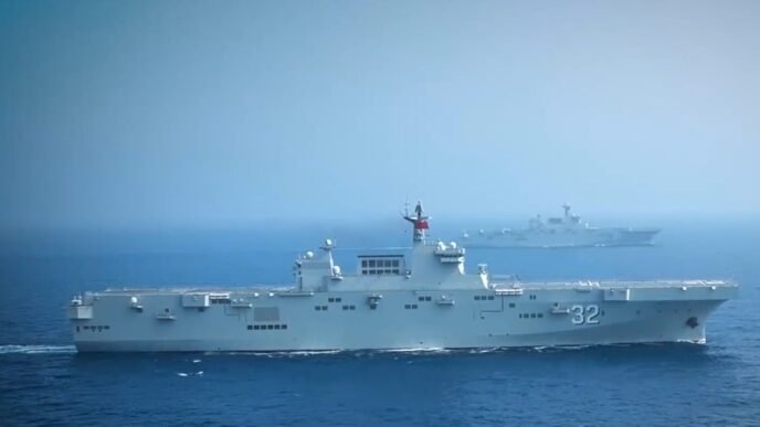 Two Type 075 amphibious assault ships of PLA Navy, the Guangxi and the Hainan, sail in formation at an undisclosed sea region in 2022. Photo: Screenshot of a video released by the PLA Navy.