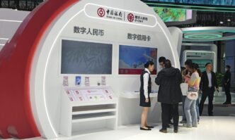 Visitors use digital yuan for payment at the 6th Digital China Summit in East China