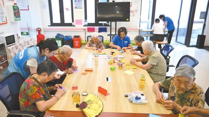 Elderly residents participate in a craft-making session at a local nursing home