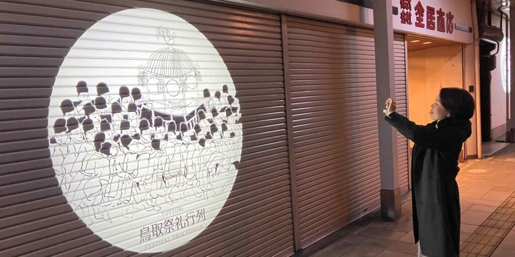 Shadows on shutters: Art brings new life to quiet Japanese shopping street