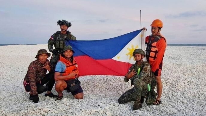 China and the Philippines both plant their flags on the same disputed sandbar