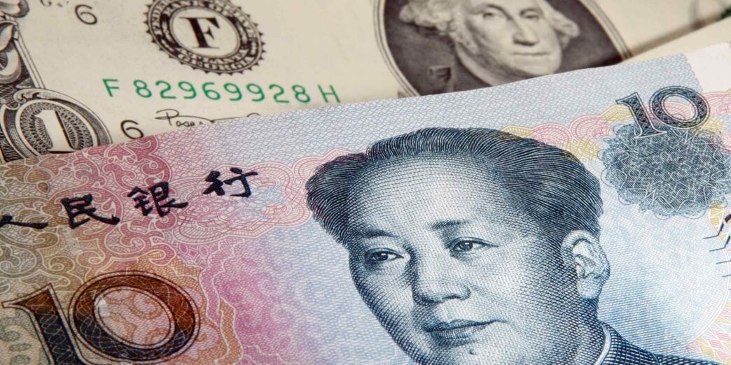 China's yuan hits 19-month low after central bank guides currency weaker