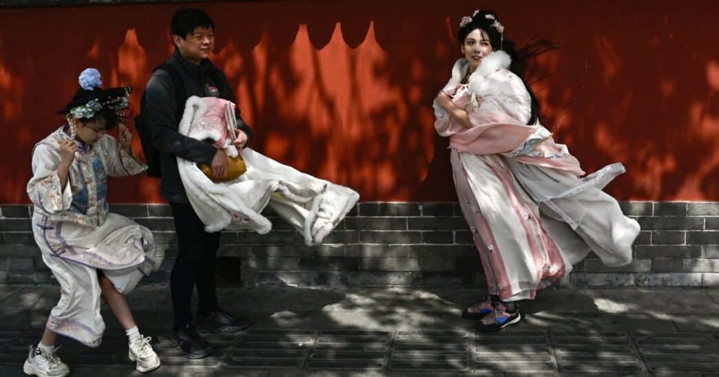 High winds and sandstorms prompt Beijing to cancel hundreds of flights and close parks