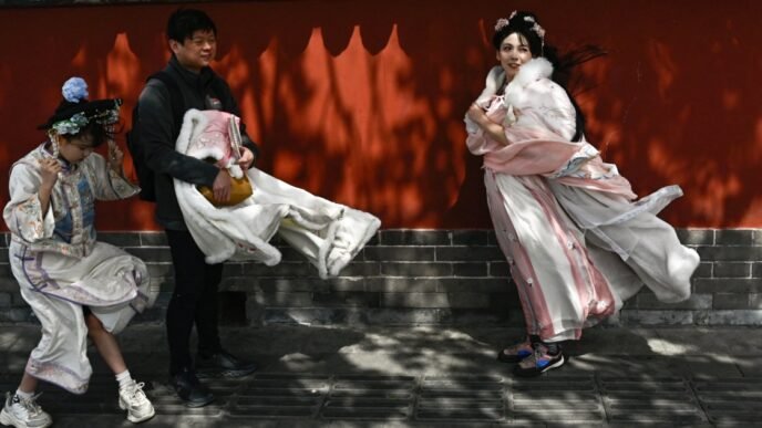 High winds and sandstorms prompt Beijing to cancel hundreds of flights and close parks
