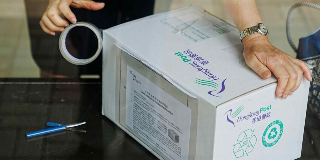 Hong Kong stops U.S.-bound parcels, strikes defiant tone on tariffs