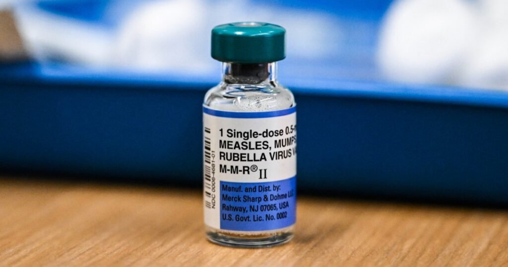 What causes breakthrough measles infections even if someone is vaccinated?