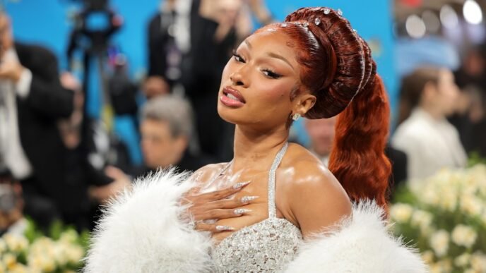 Megan Thee Stallion breaks no-phone rule at Met Gala to review the food