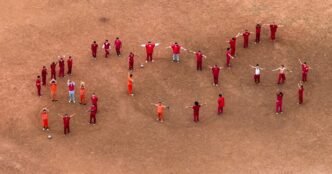 Migrants form SOS sign in Texas detention center, fear notorious El Salvador prison