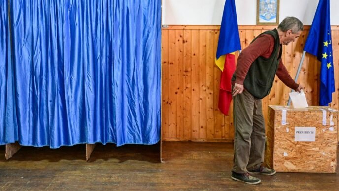 Pro-EU centrist in Romania’s tense presidential race takes lead, preliminary data shows