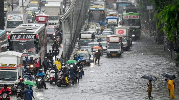 Storms kill 14 in Pakistan and flooding sparks chaos in Mumbai as early monsoon batters South Asia
