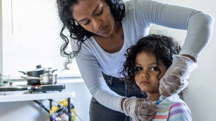 As part of her daily routine, Deysi Vargas runs a saline solution through her daughter's intravenous line before her morning shower and school.