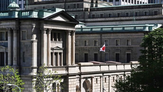 BOJ holds interest rate, will trim JGB buying by around 200bn yen