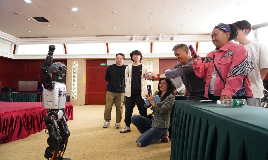 A humanoid robot interacts with the media at a press conference unveiling the 2025 World Humanoid Robot Sports Games. Photo: VCG