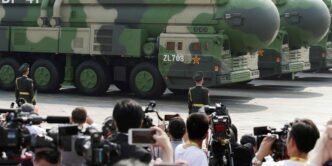 China adds 100 nuclear warheads in past year, report shows