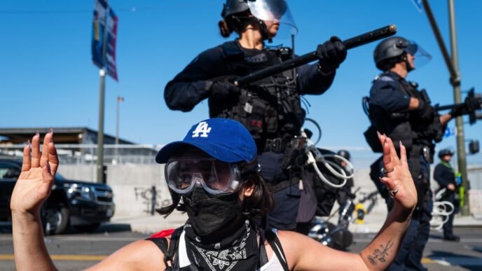 Crowds protesting immigration raids ordered to leave downtown