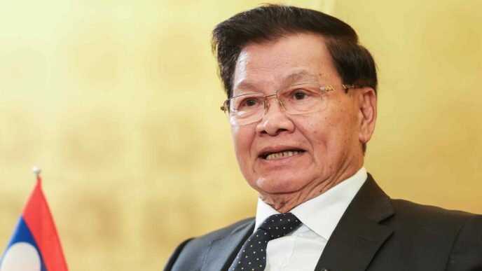 Laos president says must lure more countries to invest