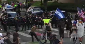 Reporter falls back with dispersed L.A. protesters amid flash-bangs, tear gas