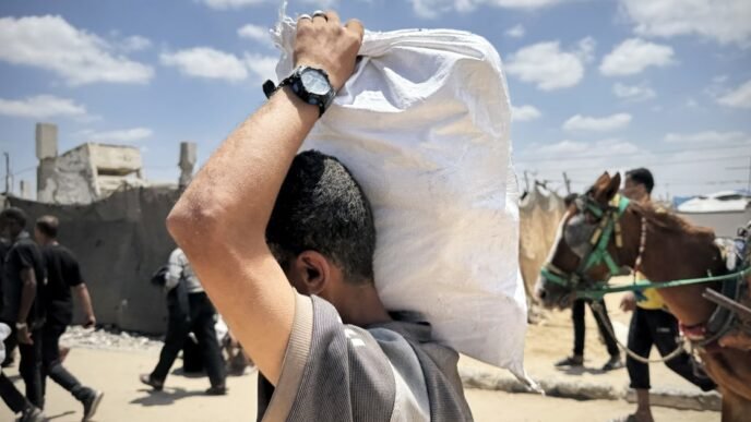 U.S.-backed aid group in Gaza reopens sites after closures and delays
