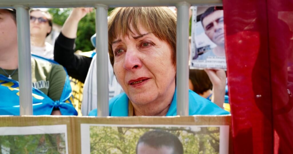 Ukrainians hope for news of loved ones among POW swap with Russia